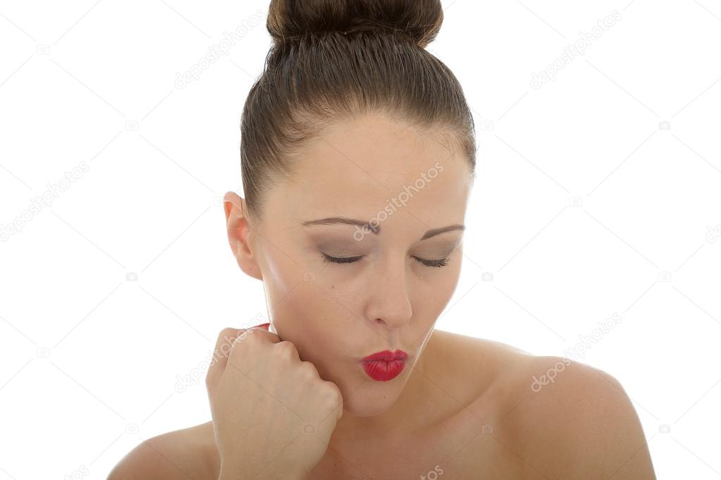 Young Woman With Her Eyes Shut Appearing To Be Ignoring A Conversation