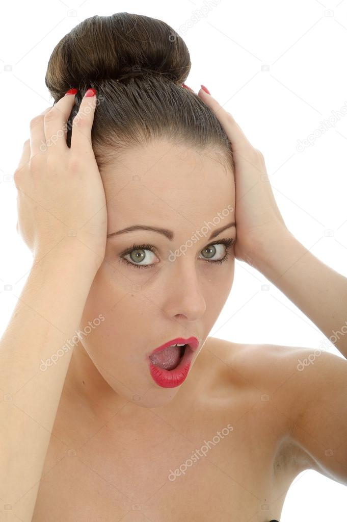 Shocked And Upset Young Woman Holding Her Head In Despair