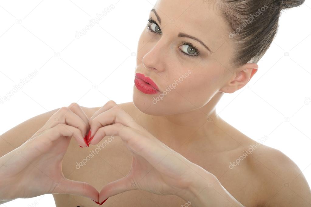 Young Woman Making A Heart Sign or Shape With Her Hands