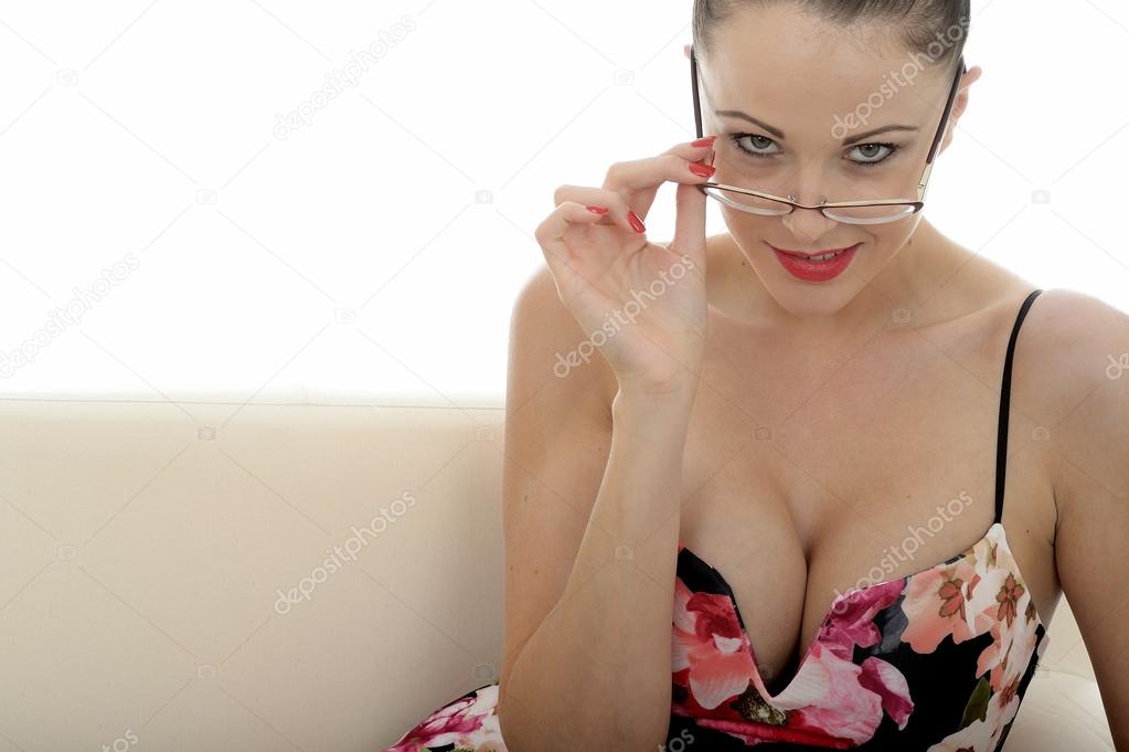 Portrait Of A Beautiful Attractive Young Caucasian Woman Holding A Pair Of Retro Glasses