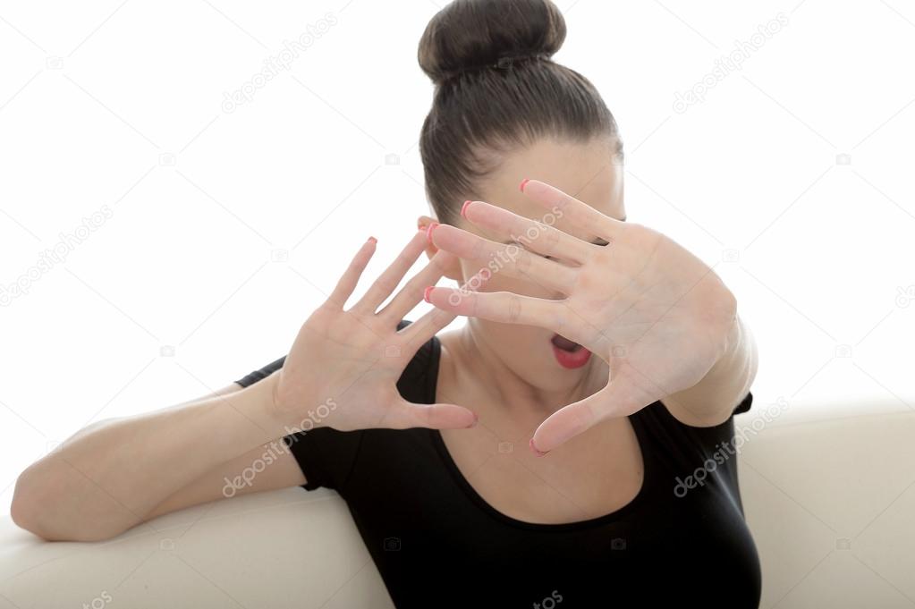 Portrait Of A Beautiful Attractive Young Caucasian Woman Holding Hand Up In Defence