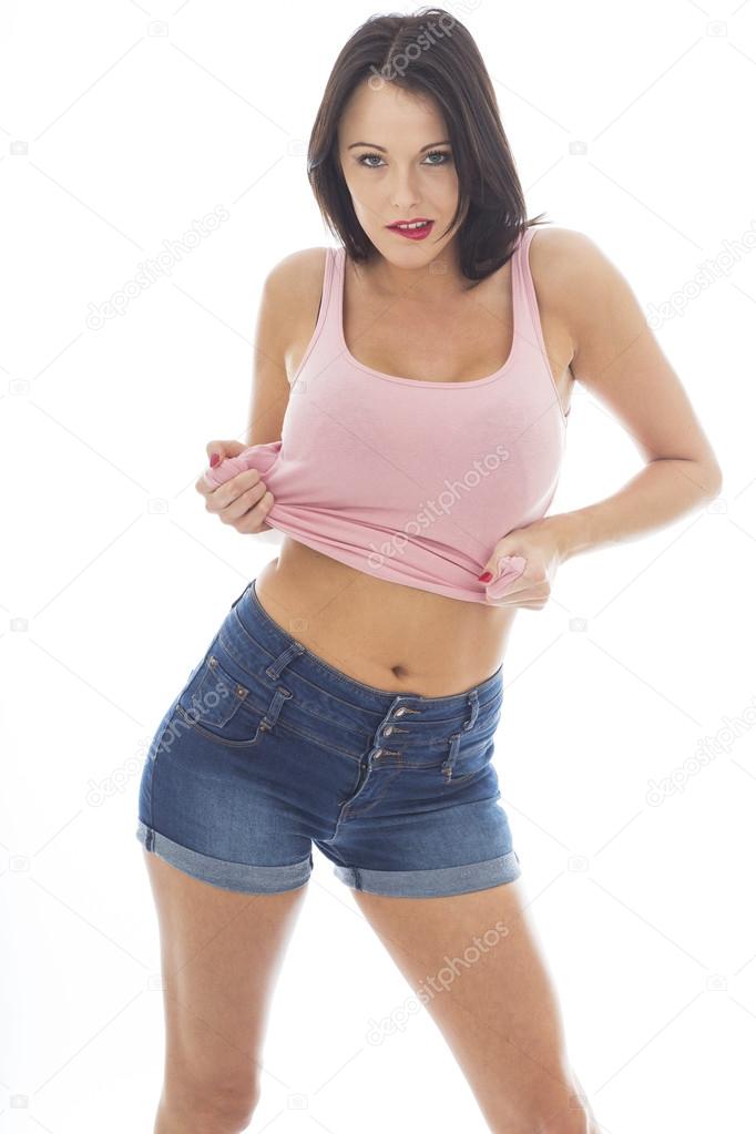 Attractive Young Caucasian Woman Wearing A Pink Vest Top and Blue Denim Shorts