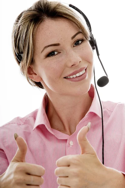 Atractiva joven mujer de negocios usando un auricular telefónico —  Fotos de Stock