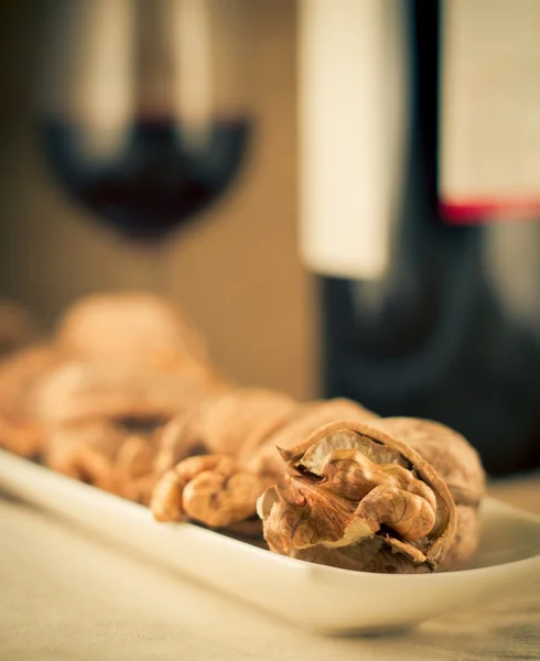 Walnuts and red wine — Stock Photo, Image