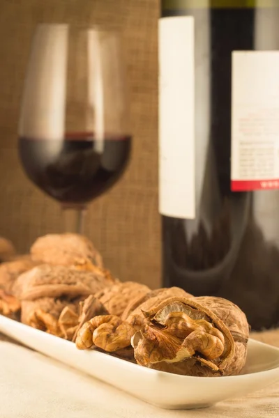 Walnuts and red wine — Stock Photo, Image