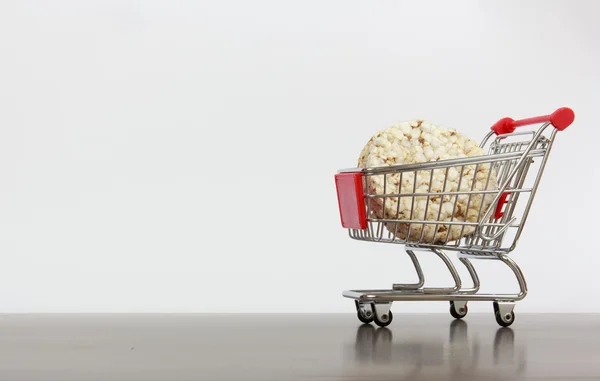 Shopping cart with biscuit — Stock Photo, Image
