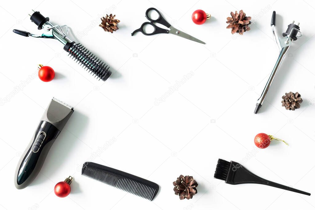 Christmas hairdresser composition frame with combs, brush, scissors, tools and accessories with new year decorations on white background. Stylish concept. Flat lay, top view with copy space.