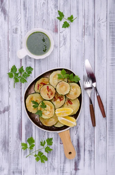 Fried Zucchini Green Sauce Wooden Background Top View Selective Focus — Foto Stock