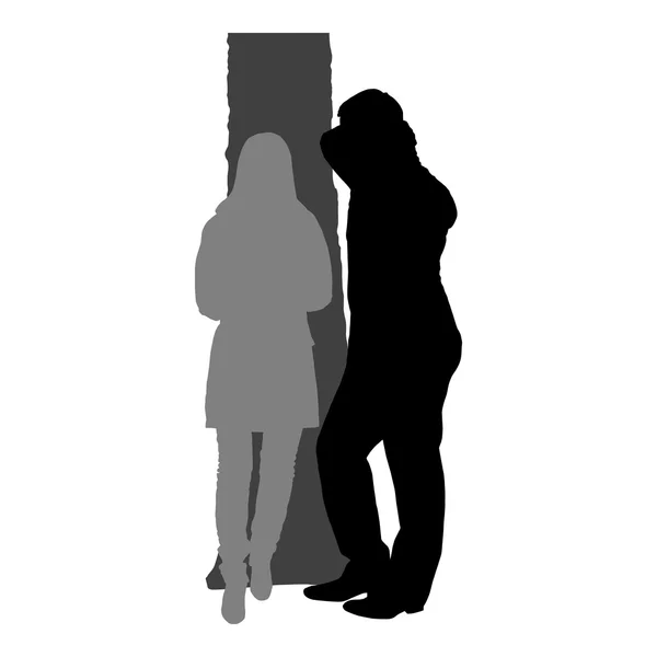 Silhouettes of romantic couple on a white background — Stock Vector