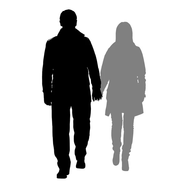 Silhouettes of romantic couple on a white background — Stock Vector