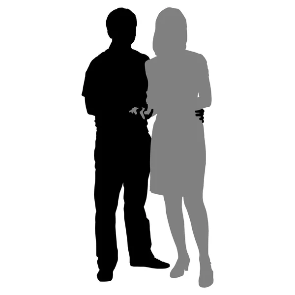 Silhouettes of romantic couple on a white background — Stock Vector