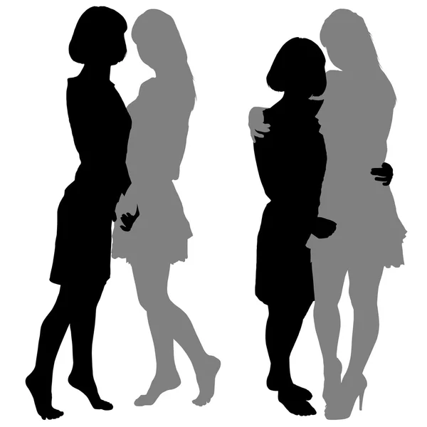 Silhouette di due giovani donne — Vettoriale Stock