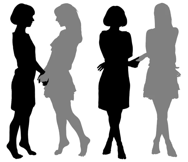 Silhouette di due giovani donne — Vettoriale Stock