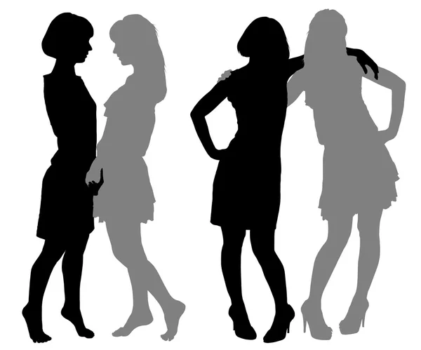 Silhouette di due giovani donne — Vettoriale Stock