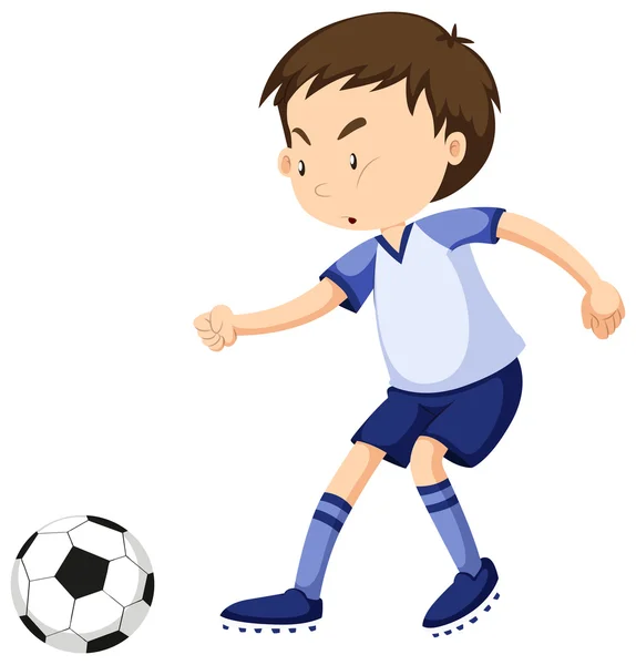 Boy playing soccer alone