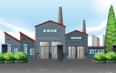 Fabrika metal çitin arkasında Binası