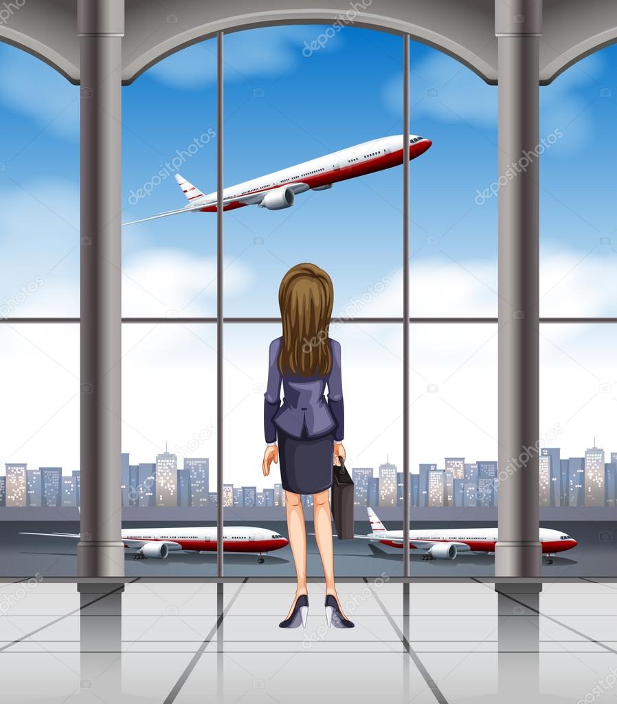 Woman looking at the plane taking off