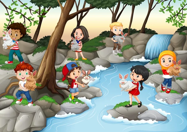 Children having fun at the waterfall