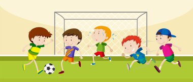Çocuklar sahada futbol oynuyor.