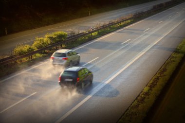 Motion blurred cars on the highway clipart