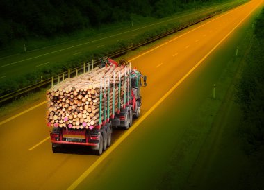 Logging truck on the highway. clipart