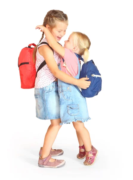 Two sisters with school bags — Stock Photo, Image