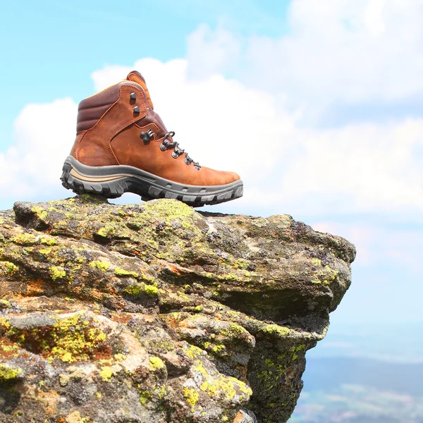 Trekking boots on the rock. — Stock Photo, Image