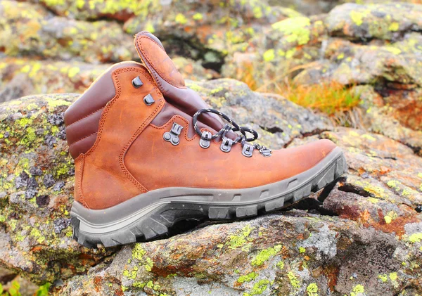 Trekking boots on the rock. — Stock Photo, Image