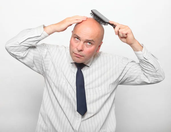 Bold man with hair brush — Stock Photo, Image