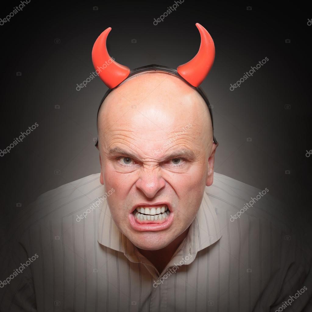 Angry man with devil horns. — Stock Photo © vladvitek 65965175