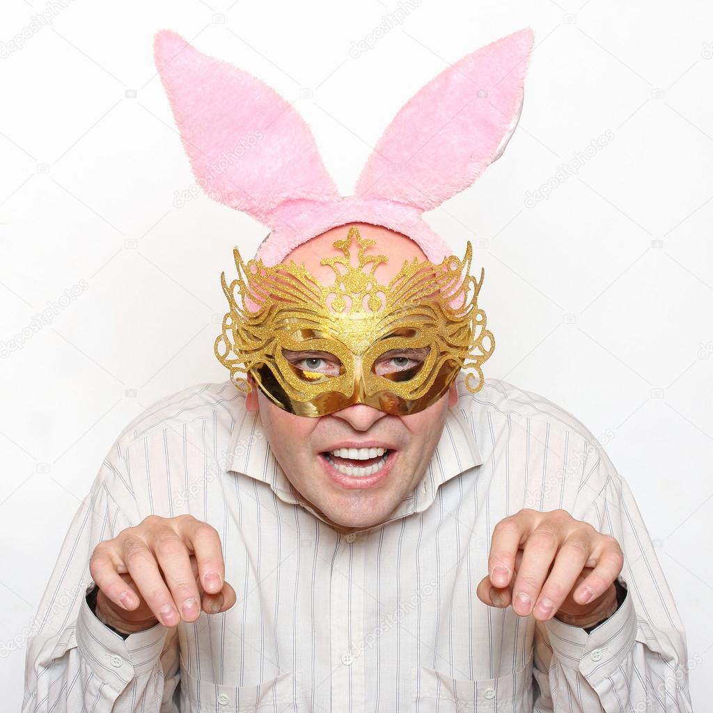 Man in love with paper mask and rabbit ears.