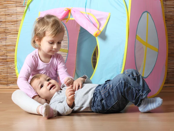 Little siblings playing together — Stock Photo, Image