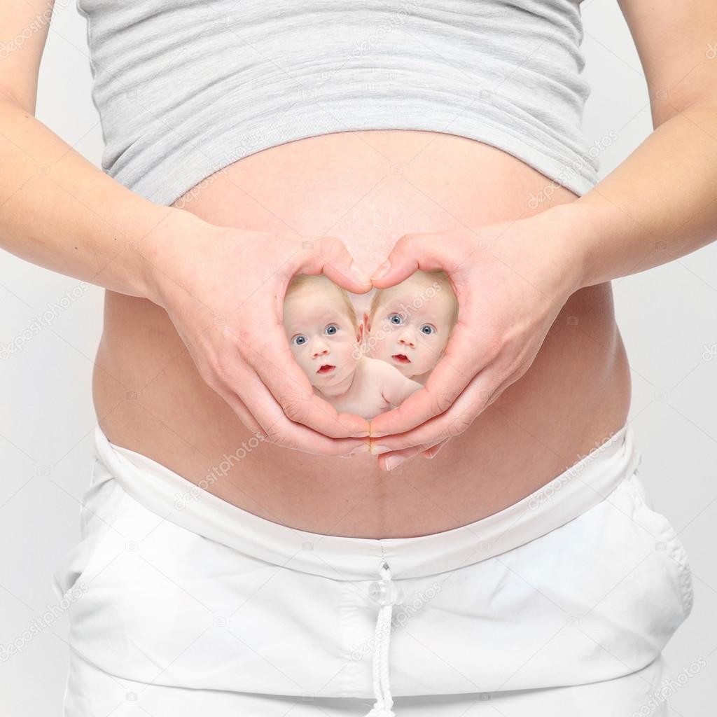  A woman's hands forming a heart symbol 