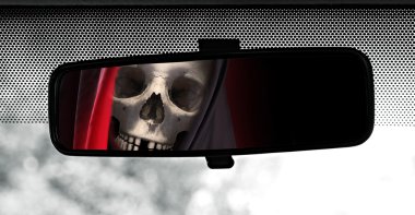 Rear view mirror reflecting Grim Reaper clipart