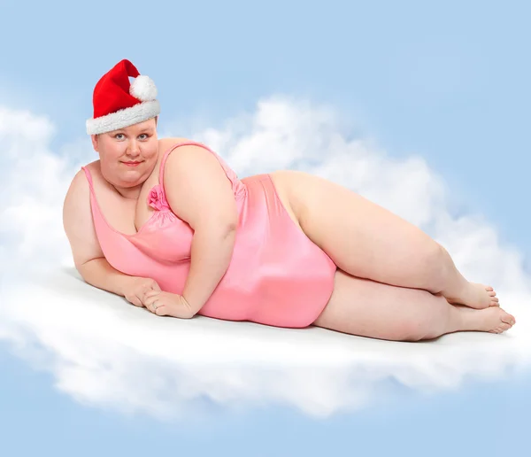 Mulher obesa com boné de Papai Noel — Fotografia de Stock