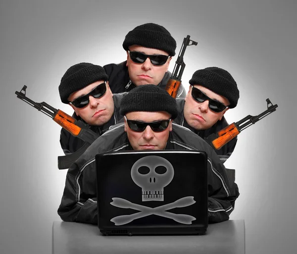 Terrorists with laptop and weapons. — Stock Photo, Image