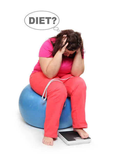 Overweight woman with weighing machine. — Stock Photo, Image