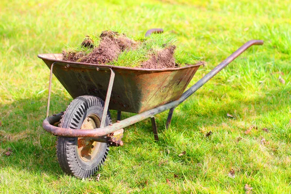 Wheelbarrow full of compost. — Stock Image Wheelbarrow full of compost. Royalty Free Stock Images