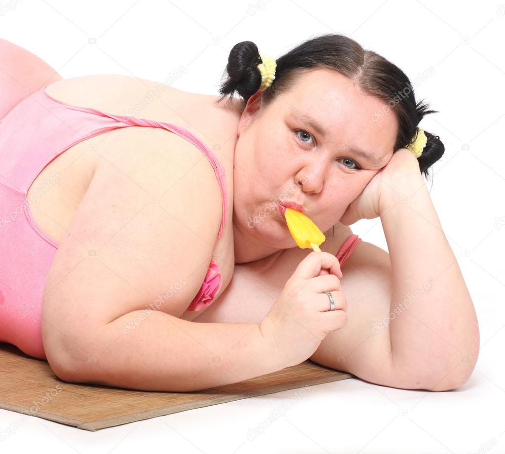 Obese woman with sweet ice lolly.
