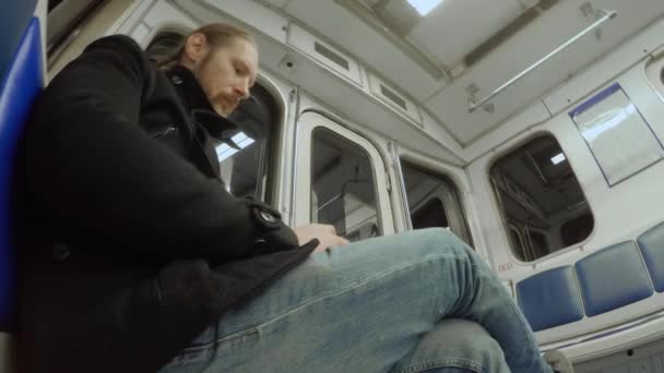 White Man Beard Long Blond Hair Sits Moving Shaking Subway — Stock Video