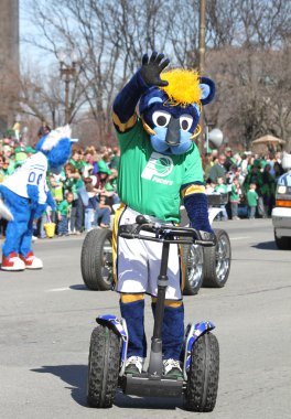 Indiana Pacers Mascot Boomer greeting people at the Annual St Patrick's Day Parade clipart