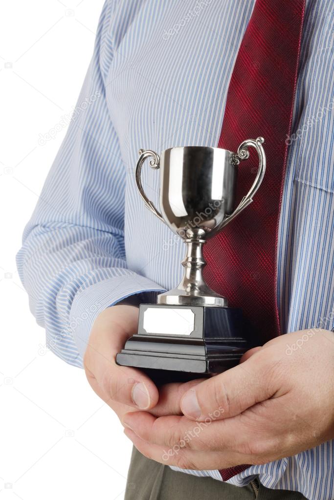 Man holding a trophy cup