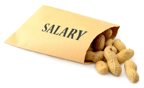 Peanuts falling out of an envelope — Stock Photo, Image