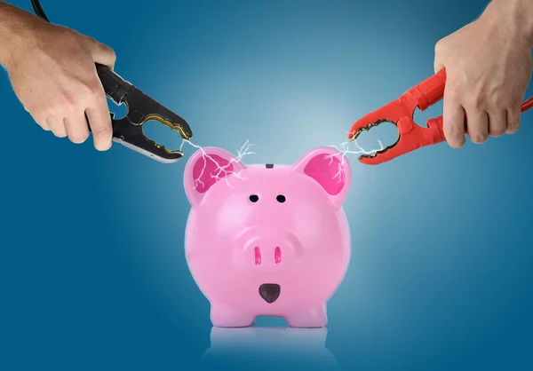 Verbindingslijnen met vonken tussen een piggy bank — Stockfoto