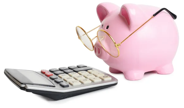 Piggy bank and calculator — Stock Photo, Image