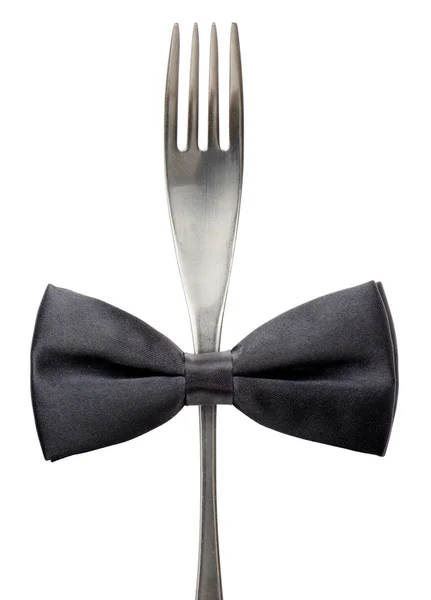 Black bow tie on a fork — Stock Photo, Image