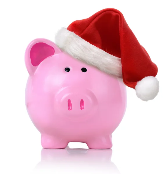 Piggy bank with santa hat Stock Image