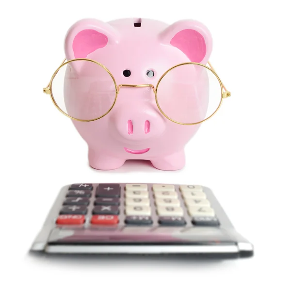Piggybank e calculadora — Fotografia de Stock