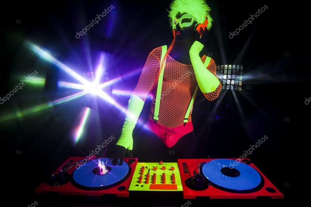 Sexy neon dj glow man turntables Stock Photo by ©dubassy 115407112