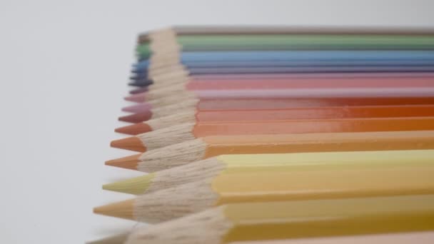 Coloured pencils in a row — Stock Video